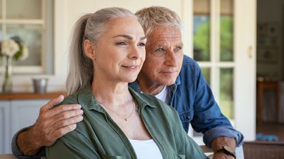 A senior couple looking off into the distance.