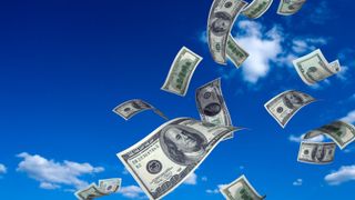 money flying in blue sky