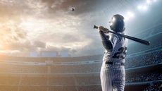 A baseball player hitting a no-doubt home run in a giant stadium