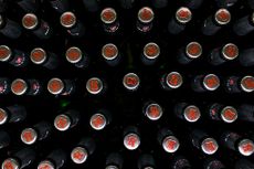 The Beck's key logo sits on bottle tops on the production line at the Beck's brewery, operated by Anheuser-Busch InBev NV, in Bremen, Germany, on Wednesday, Nov. 4, 2015. U.K. regulators gave AB InBev yet another week to make a formal takeover offer for SABMiller Plc as the two brewers inch closer to securing the industry's biggest-ever deal. Photographer: Jasper Juinen/Bloomberg